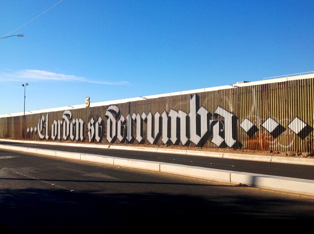 Political Graffiti lettering bomb by Said DokinsEl orden se derrumba (Order Collapses), Borderline México - USA
